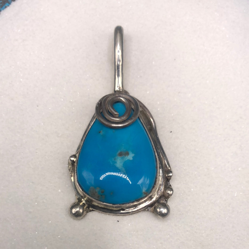 Sterling Silver swirl and stabilized Sleeping Beauty Turquoise pendant